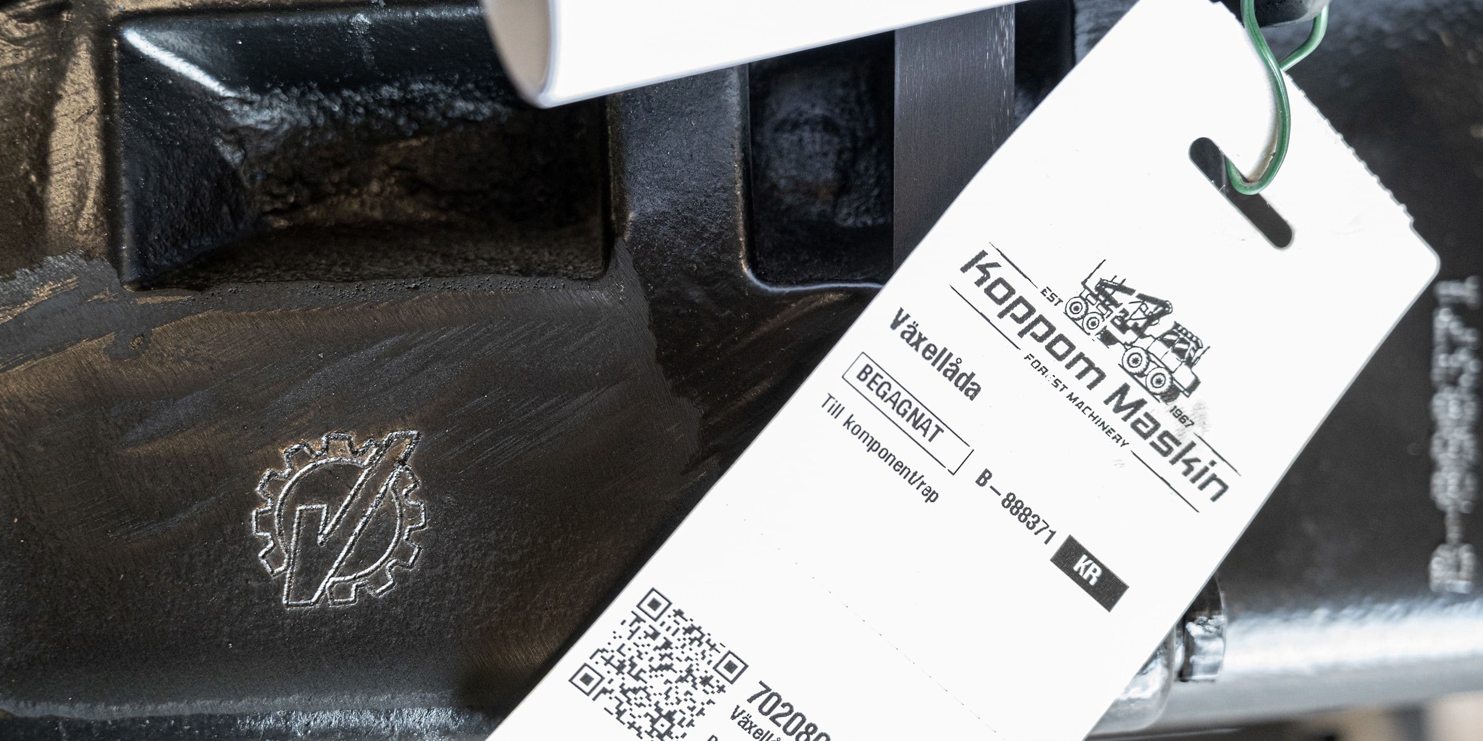 KM Certified-etiketten fäst på en reservdel